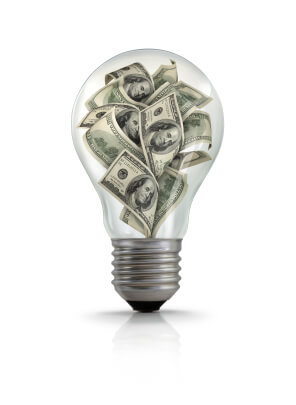 Illustration of American one hundred dollars bills inside lightbulb