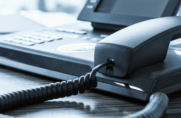 Business phone on an office desk